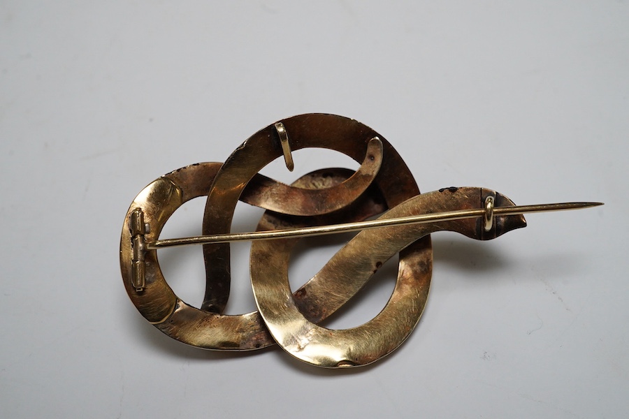 A Victorian yellow metal and gem set coiled serpent brooch, 47mm, together with two 1960's 9ct gold and gem set rings, gross weight 12.5 grams. Condition - poor to fair